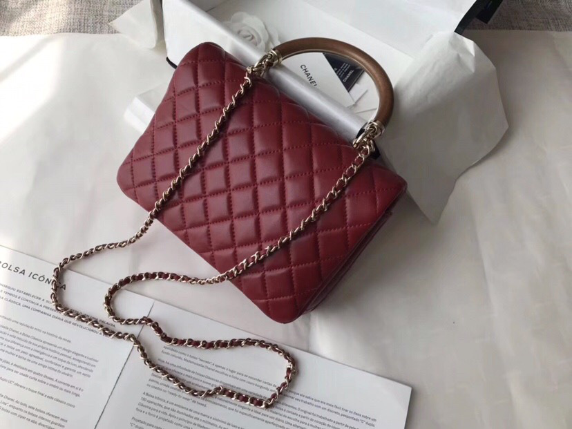 Ch**el flap bag with top handle wine red 21cm