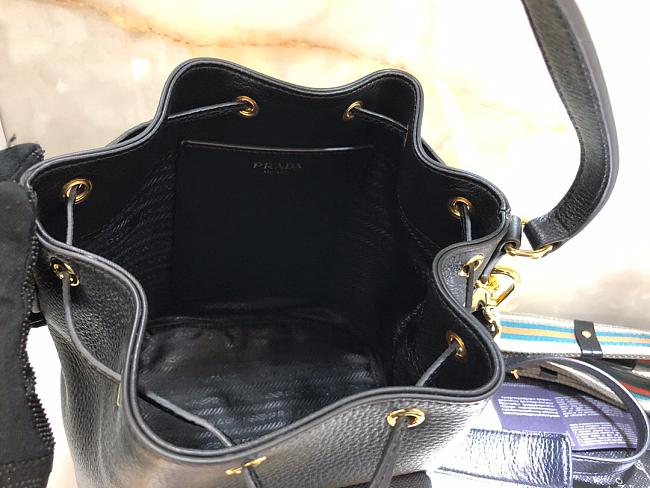Pra*a bucket bag with metal logo and shoulder strap black 1be030 21 × 25 × 15 cm